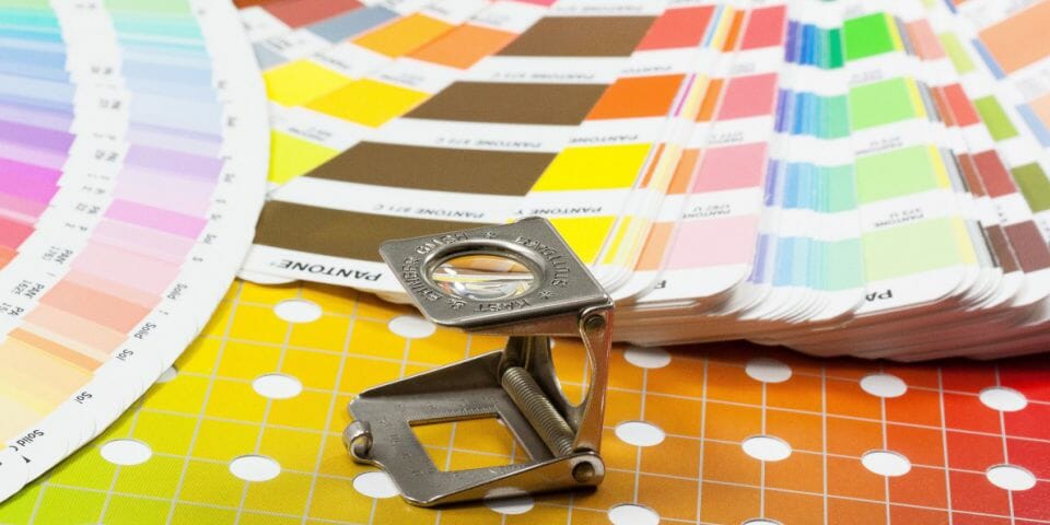 Pantone colour swatch and magnifying glass