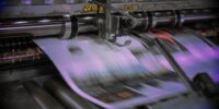 A high speed commercial offset printing machine in action